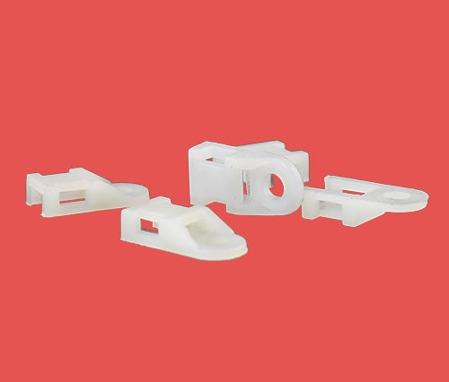 Group of natural cable tie eyelets showing screw-mount heads for secure fastening