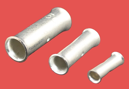 Copper tube butt connectors in three sizes, laying flat side by side.
