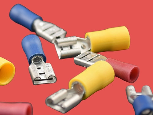 Assorted pre-insulated female spade connectors in red, blue, and yellow.