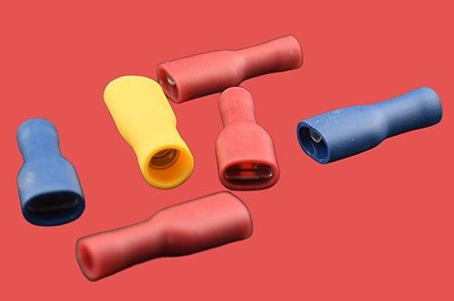 Assorted fully insulated female spade connectors in red, blue, and yellow.