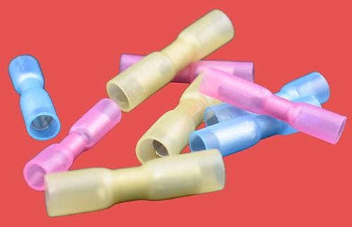 Assorted heat shrink female bullet connectors in red, blue, and yellow.