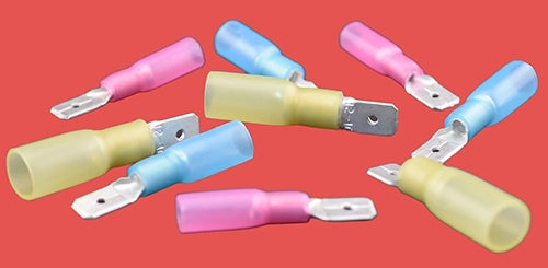 Assorted heat shrink male blade connectors in red, blue, and yellow.