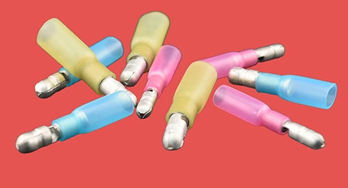 Assorted heat shrink male bullet connectors in red, blue, and yellow