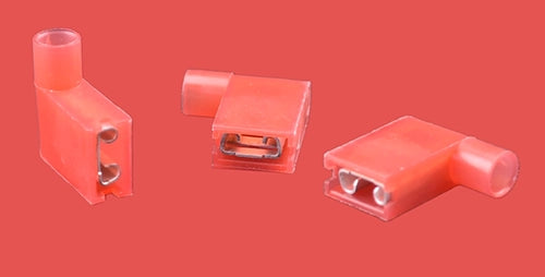 Red insulated flag terminals in different orientations showing blade and insulation.