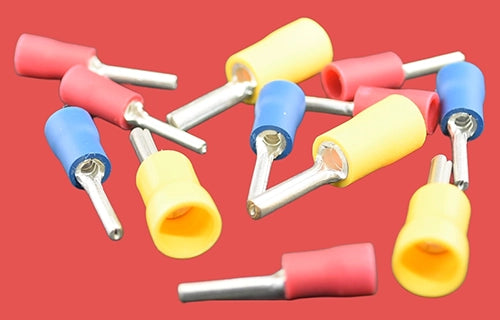 Assorted pre-insulated pin connector terminals in red, blue, and yellow.
