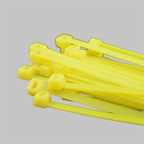 Neon yellow cable ties bundle on grey background - fluorescent yellow zip ties for high visibility safety applications