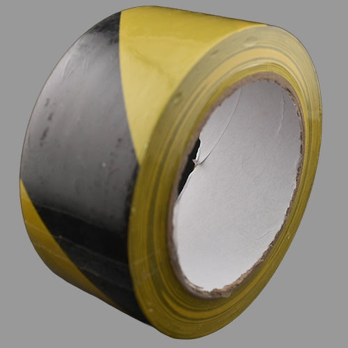 Black and yellow hazard tape on its end.