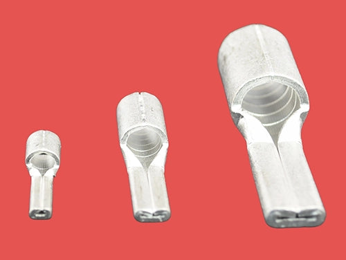 Three  copper pin terminals in different sizes, standing upright, reverse view.