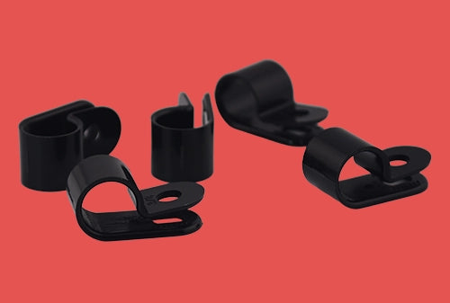Group of five black nylon P clips viewed from multiple angles for secure cable mounting