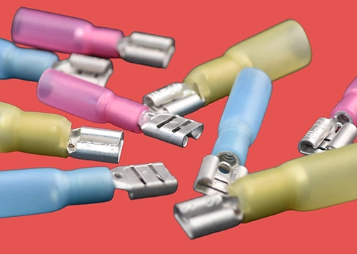 Assorted heat shrink female spade connectors – red, blue, and yellow insulated terminals for secure electrical connections