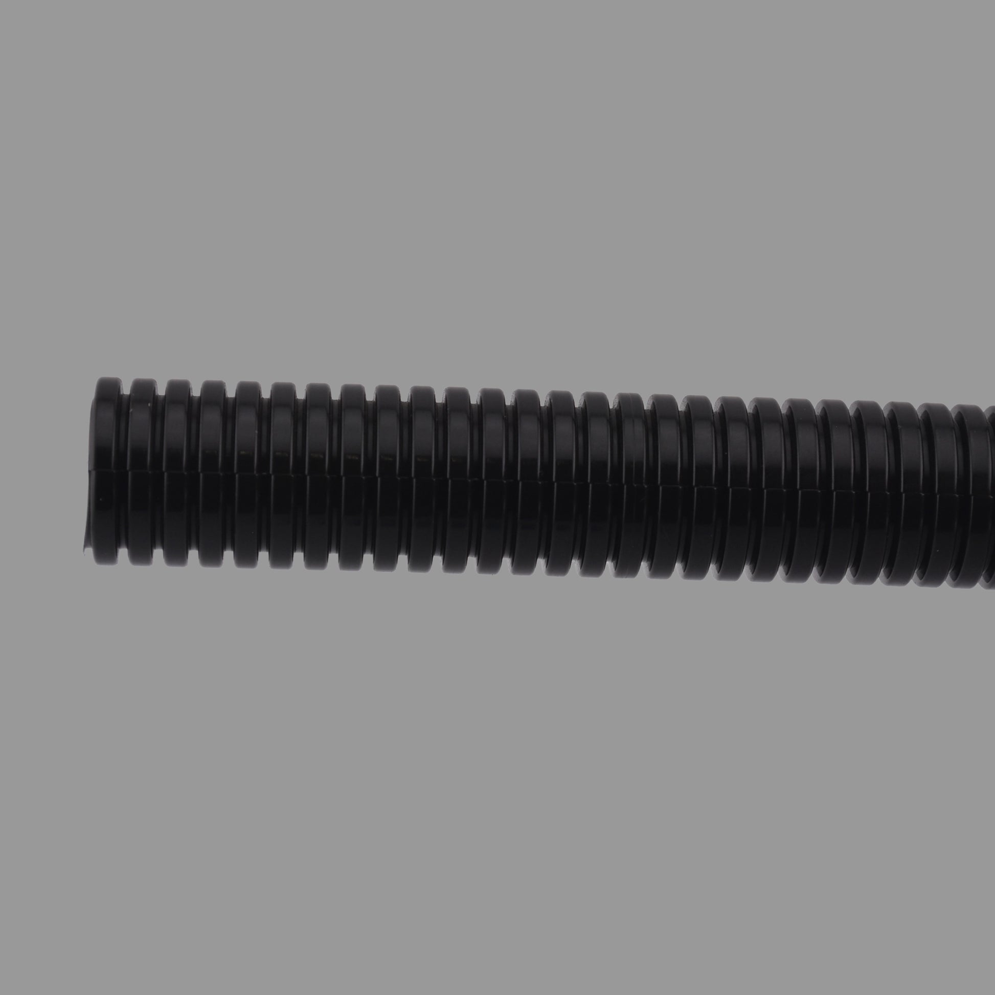 Close-up of black nylon non-split corrugated conduit showing ribbed structure