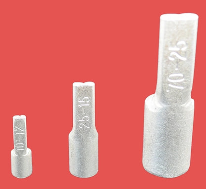 Three  copper pin terminals in different sizes, laying flat with pin ends facing the camera.