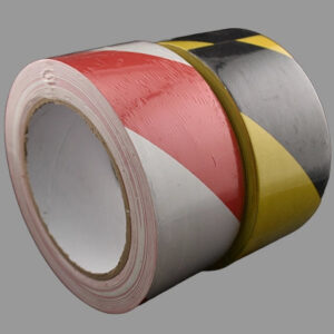 Black and yellow and red and white hazard tapes side by side.