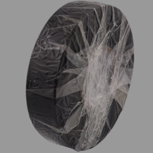 Non-adhesive black PVC tape standing on its end.