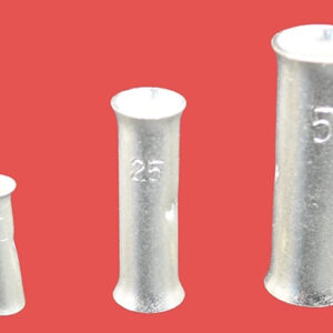 Copper tube butt connectors in three different sizes, standing upright on their ends.