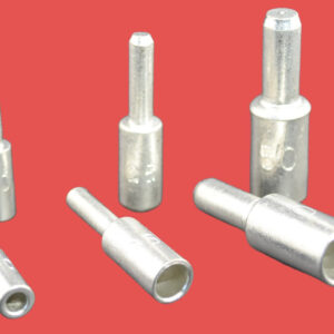 A set of copper tube pins of various sizes arranged against a red background.
