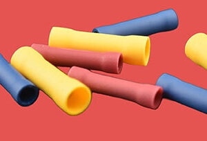 Assorted pre-insulated butt connectors in red, blue, and yellow.