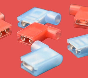 Assorted insulated flag terminals in red and blue, various orientations.