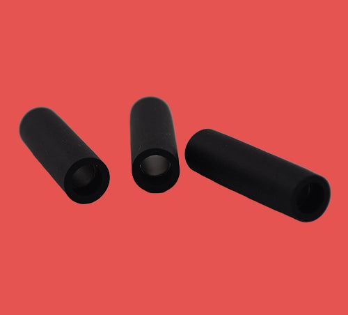 Three single brass bullet connectors laying flat highlighting wire insertion ends and bullet socket detail