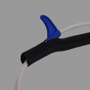 Blue split conduit installation tool inserting cable into black nylon split conduit