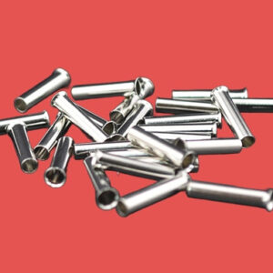 Loose pile of uninsulated bootlace ferrules for electrical trade use